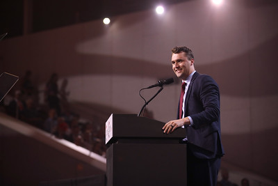 Charlie Kirk speaking with attendees